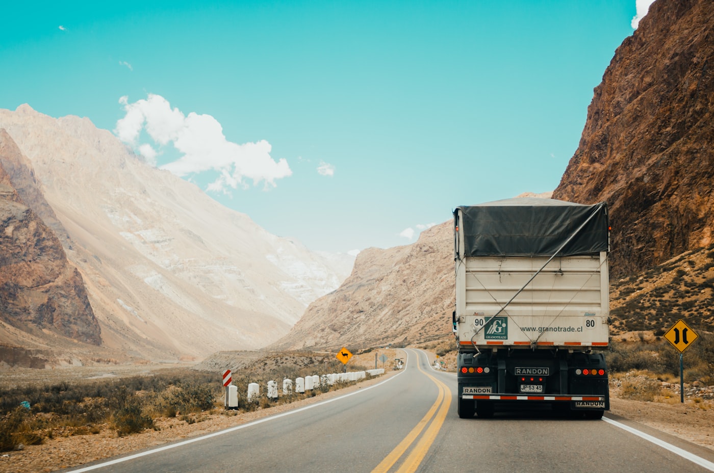 Freight trucks moving cargo on highway
